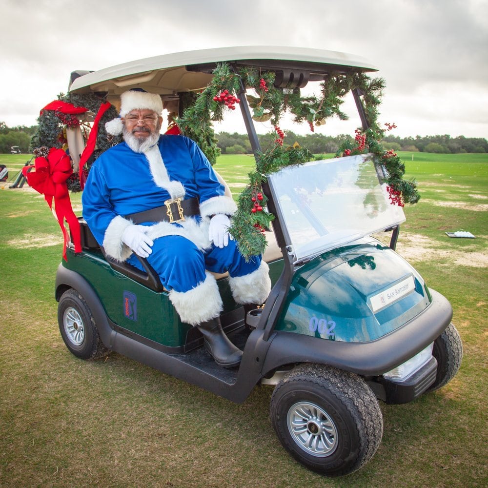 Blue Santa golf cart